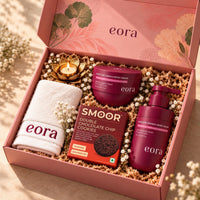 EORA Moisture Drench Diwali gift hamper with body wash, body cream, eora towel, candle and Smoor cookies in a pink gift box