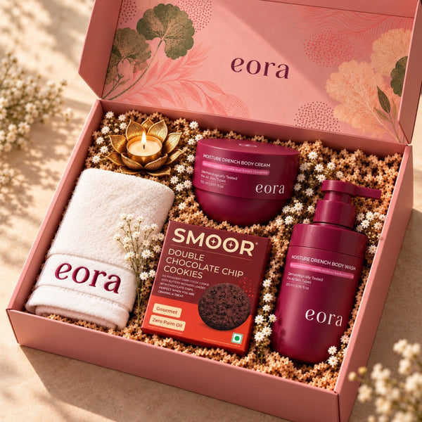EORA Moisture Drench Diwali gift hamper with body wash, body cream, eora towel, candle and Smoor cookies in a pink gift box